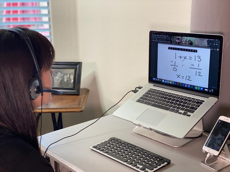 Tutor working online with a student